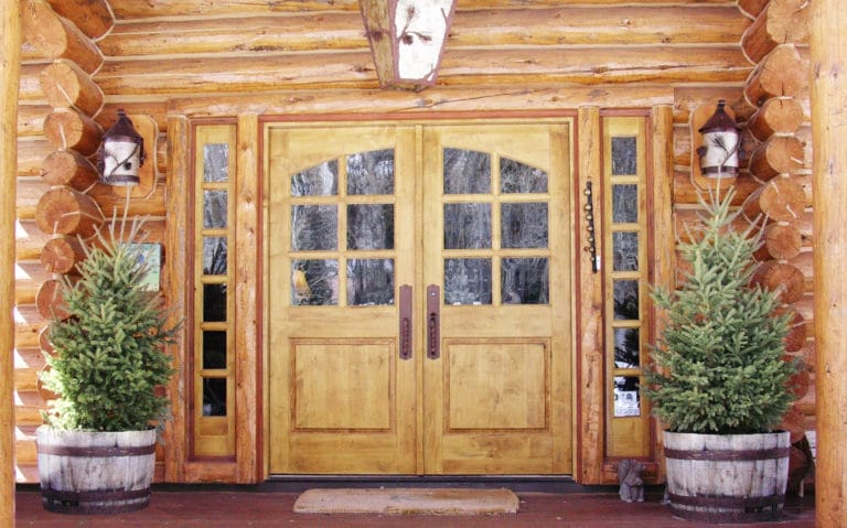 Huge door made out of wood in a log cabin