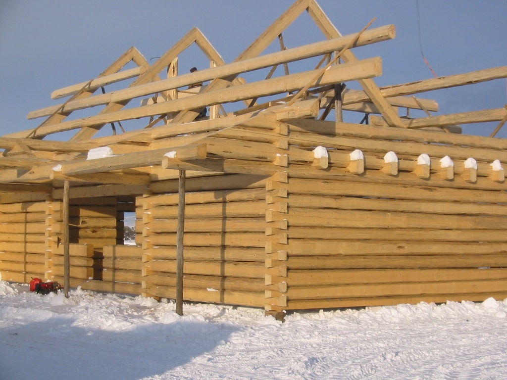 mountain modern home design — heavy timber roof framing raised on a Colorado mountain site