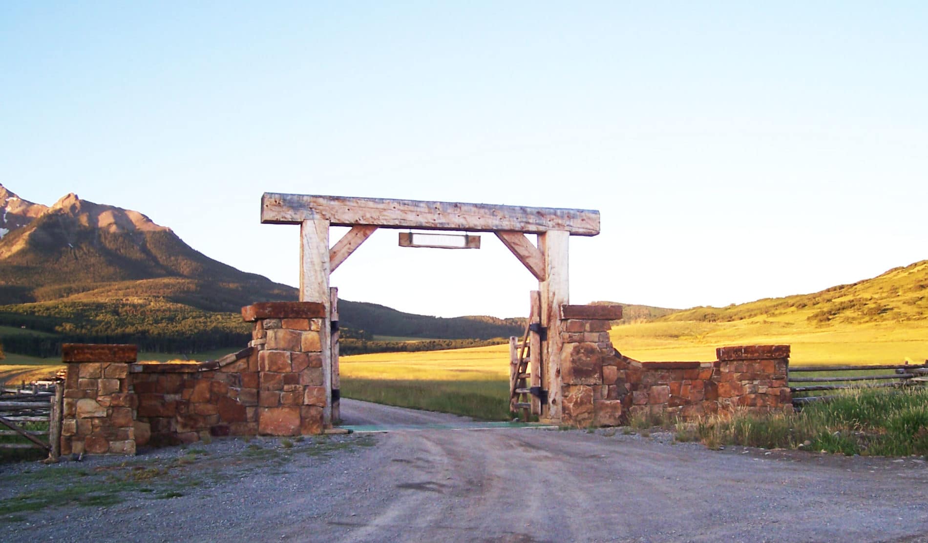 barndominium builders in colorado — timber entry on Western Slope acreage where a barndominium build begins