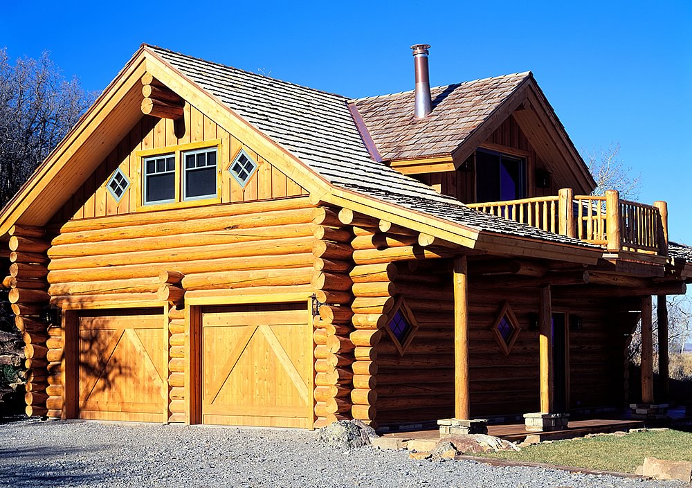 Log home builders at Frontier Log Homes — handcrafted full round log house in Colorado