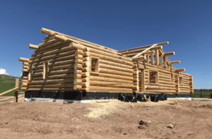 The three stages of a dry-in home build from Frontier Log Homes