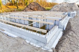 Stepped concrete foundation stem wall of the kind a sloped lot requires