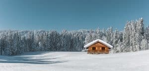 Snow and sun exposure shorten the life of a log home stain
