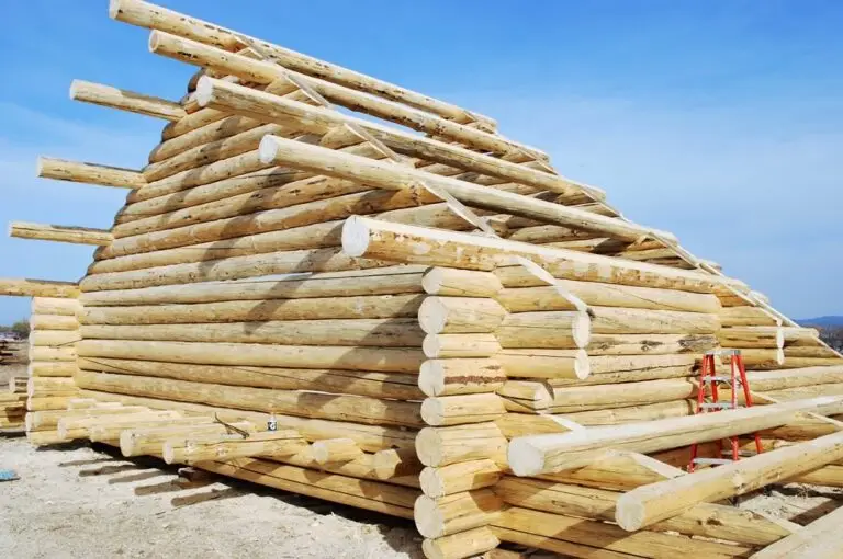 Custom log home under construction by Frontier Log Homes general contractor — photo 85