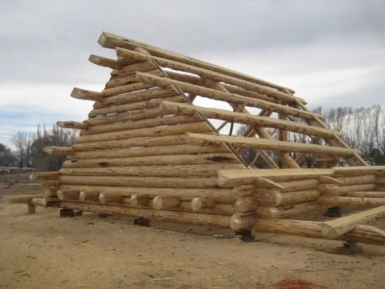 Custom log home under construction by Frontier Log Homes general contractor — photo 76