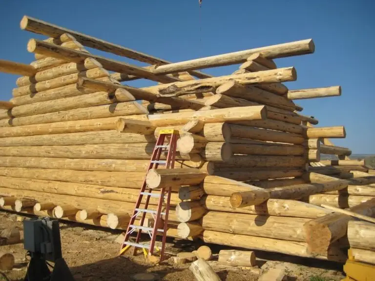 Custom log home under construction by Frontier Log Homes general contractor — photo 74