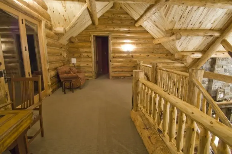 Log cabin interior of a handcrafted custom log home — photo 35