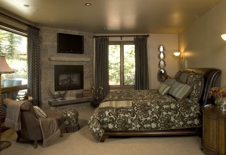 Log cabin bedroom in a custom log home — photo 13