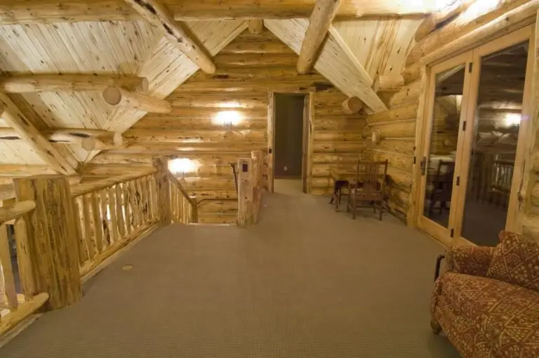 Log cabin interior of a handcrafted custom log home — photo 34