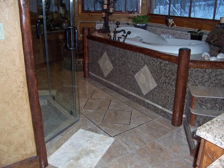 Log home bathroom in a custom handcrafted log house — photo 10