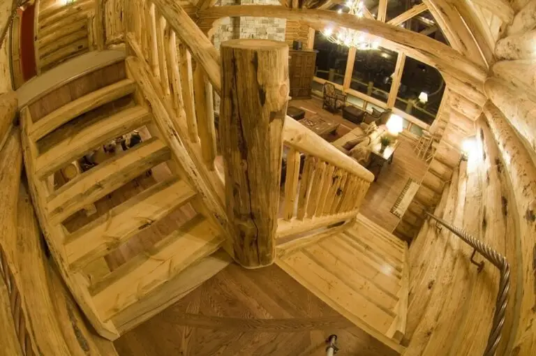 Log cabin interior of a handcrafted custom log home — photo 33