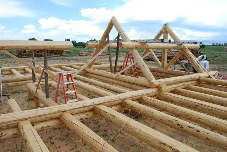 Custom log home under construction by Frontier Log Homes general contractor — photo 70