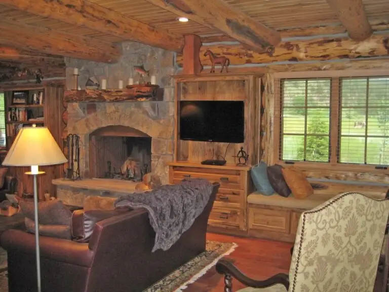 Log cabin interior of a handcrafted custom log home — photo 31