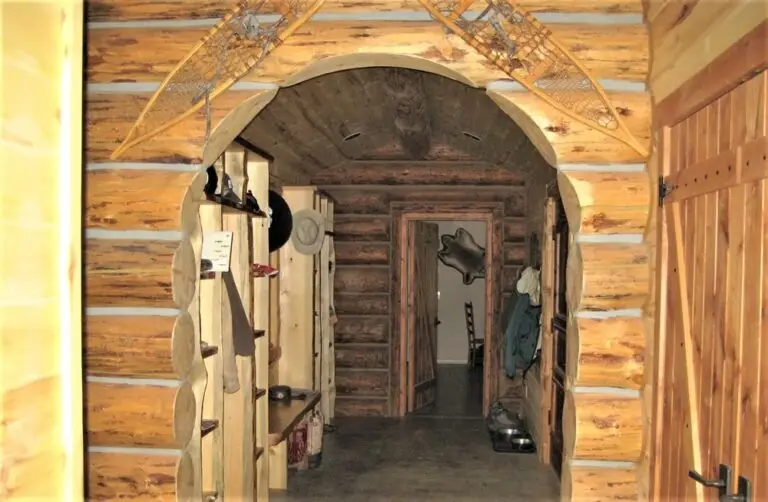Log cabin interior of a handcrafted custom log home — photo 29