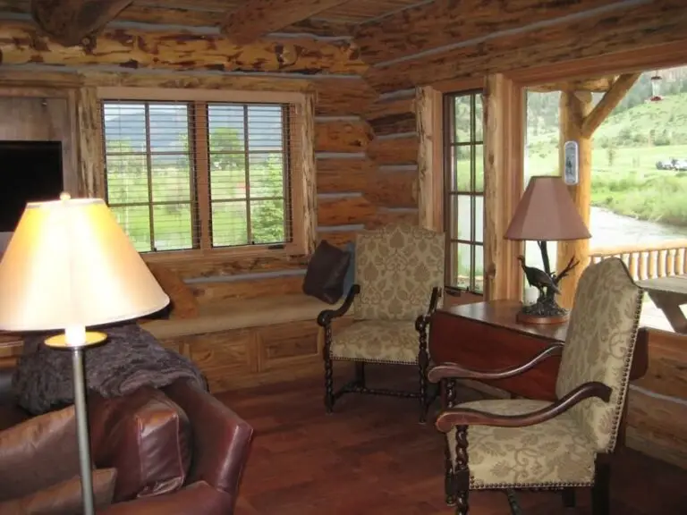 Log cabin interior of a handcrafted custom log home — photo 28