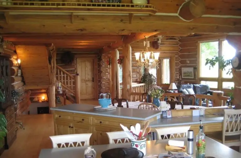 Log cabin interior of a handcrafted custom log home — photo 27