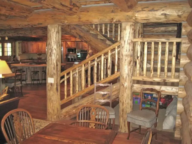 Log cabin interior of a handcrafted custom log home — photo 26