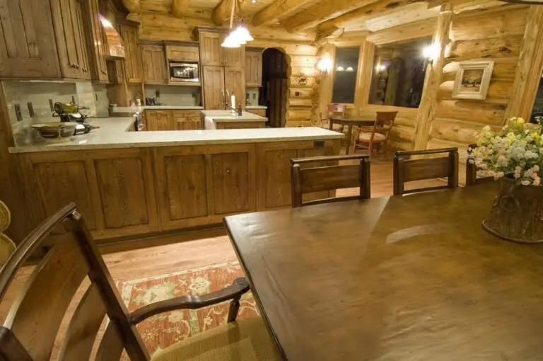 Log home kitchen and dining area in a custom build — photo 15