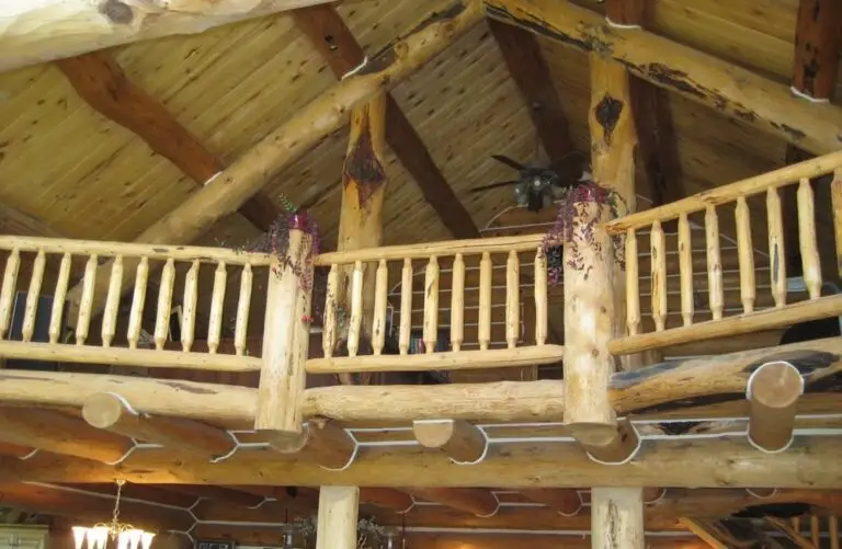 Log cabin interior of a handcrafted custom log home — photo 25