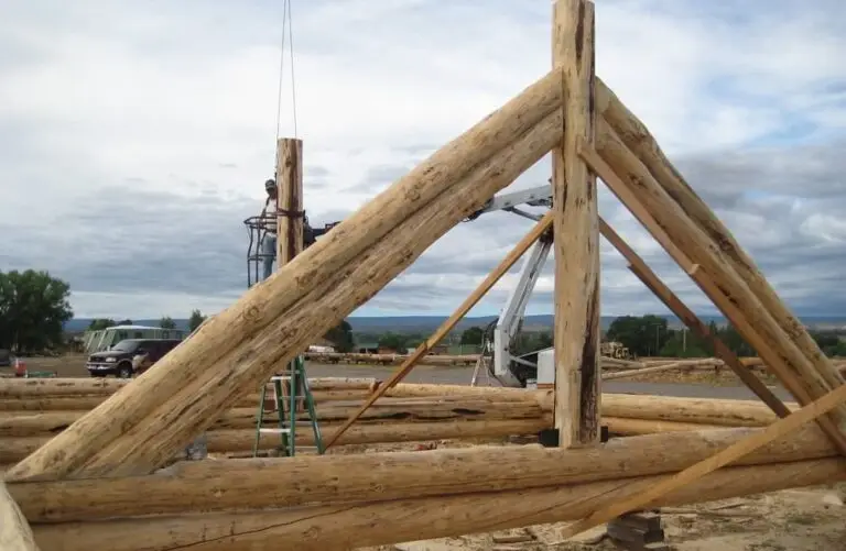 Custom log home under construction by Frontier Log Homes general contractor — photo 62
