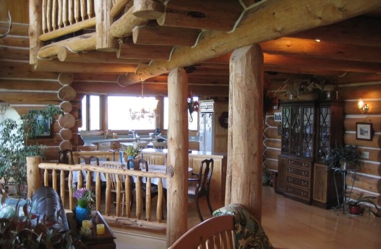 Log cabin interior of a handcrafted custom log home — photo 24
