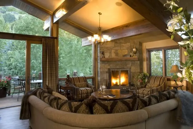 Log home great room and living area with exposed logs — photo 8