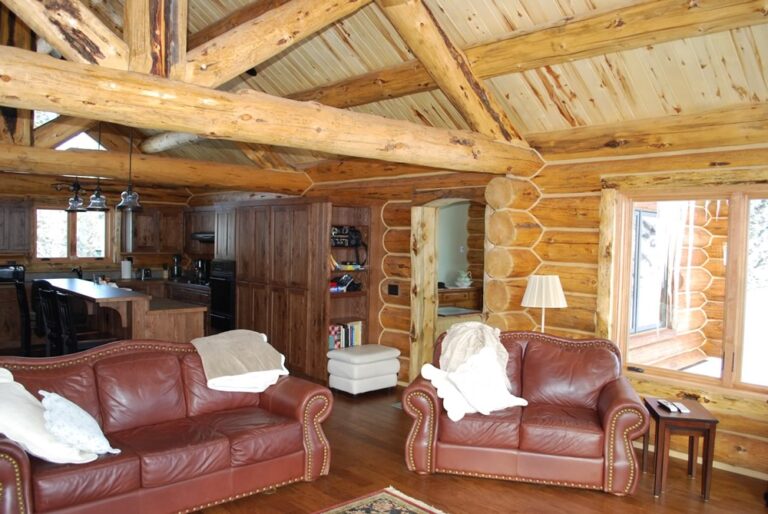 Log cabin interior of a handcrafted custom log home — photo 22
