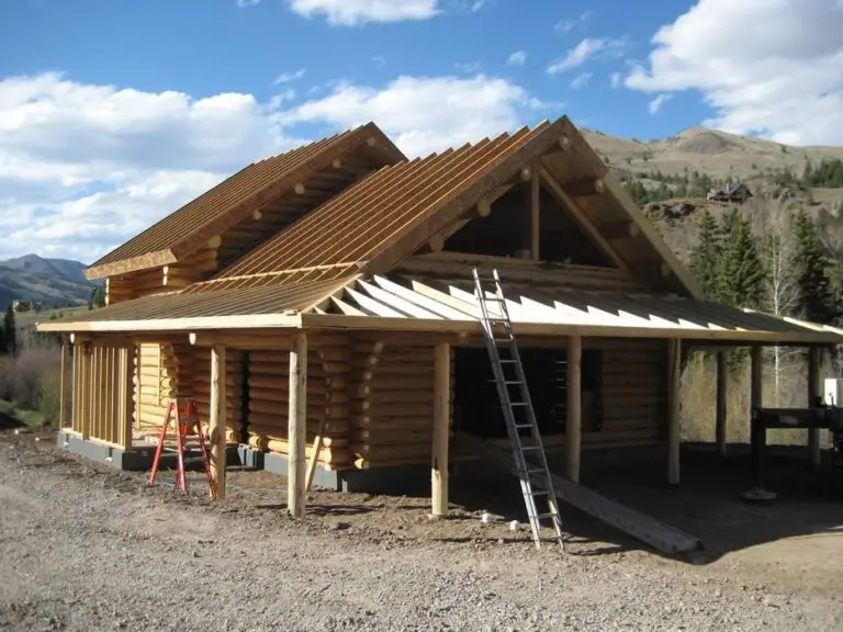 Custom log home under construction by Frontier Log Homes general contractor — photo 59
