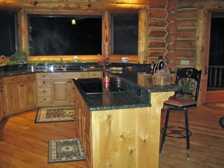 Log home kitchen and dining area in a custom build — photo 11