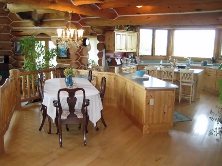 Log home kitchen and dining area in a custom build — photo 9