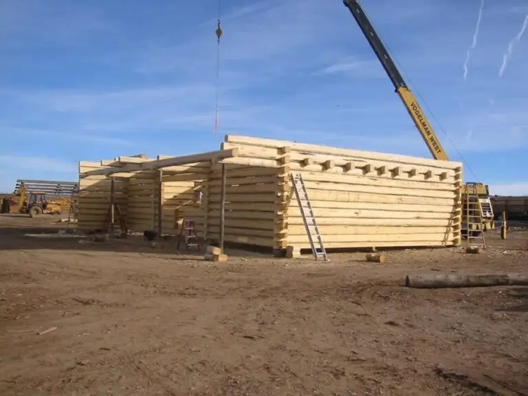 Custom log home under construction by Frontier Log Homes general contractor — photo 82