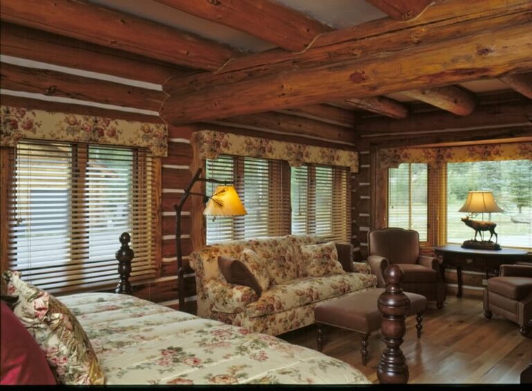 Log cabin bedroom in a custom log home — photo 23