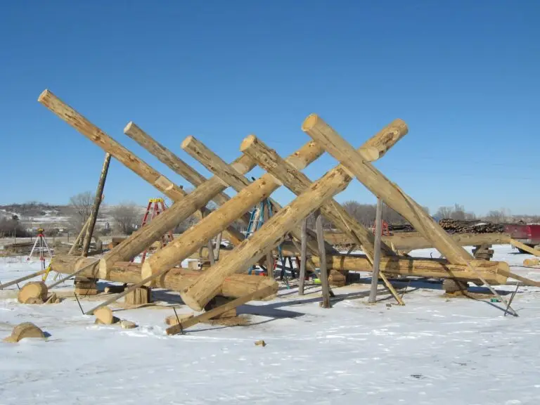 Custom log home under construction by Frontier Log Homes general contractor — photo 83