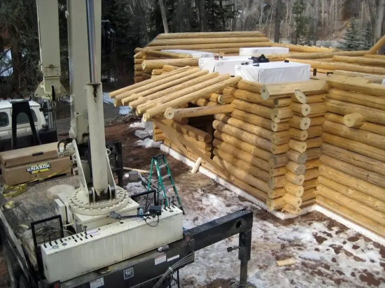 Custom log home under construction by Frontier Log Homes general contractor — photo 55