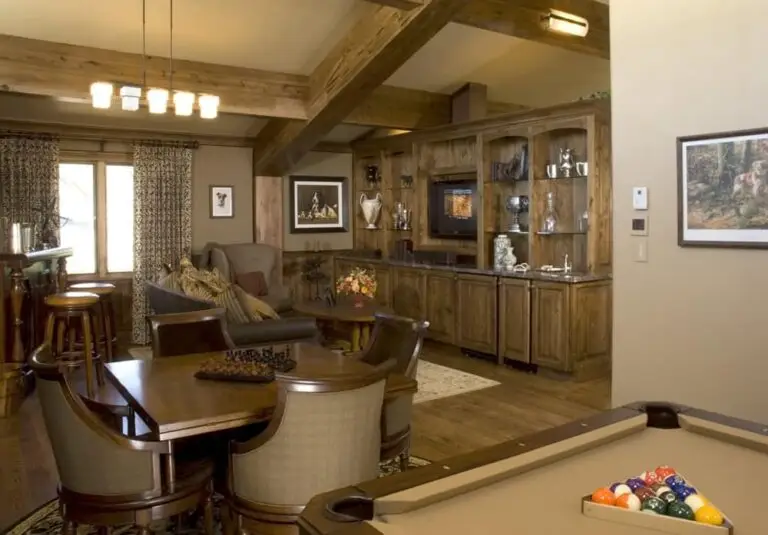 Log home great room and living area with exposed logs — photo 2