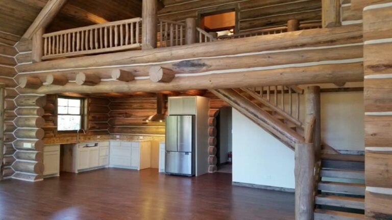 Log cabin interior of a handcrafted custom log home — photo 16