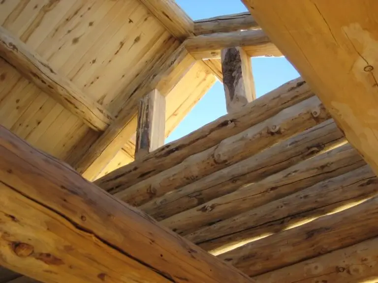 Custom log home under construction by Frontier Log Homes general contractor — photo 53