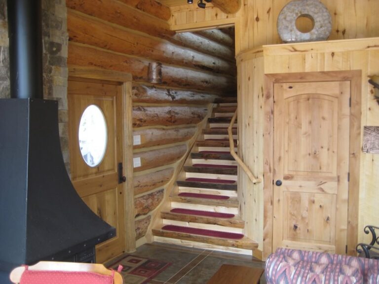 Log cabin interior of a handcrafted custom log home — photo 14