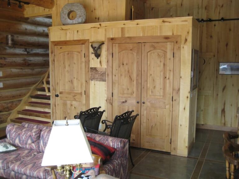 Log cabin interior of a handcrafted custom log home — photo 13