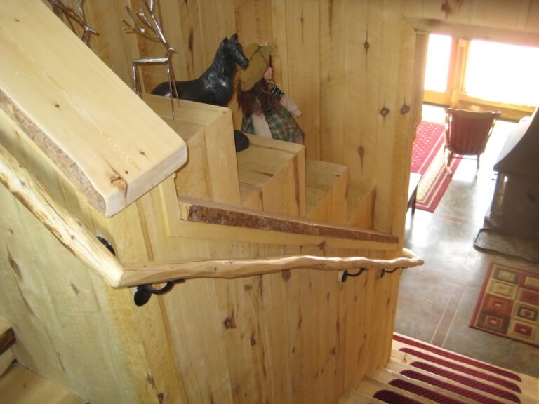 Log cabin interior of a handcrafted custom log home — photo 12