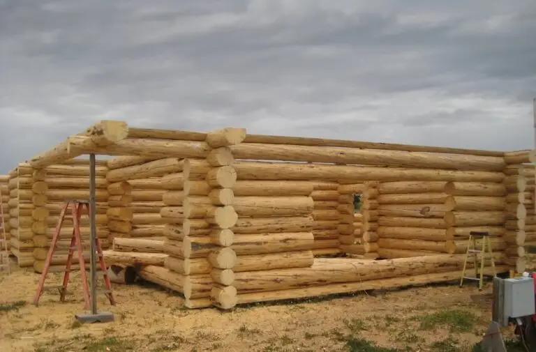 Custom log home under construction by Frontier Log Homes general contractor — photo 49