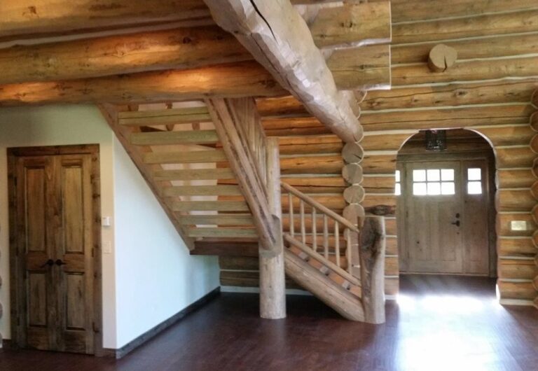 Log cabin interior of a handcrafted custom log home — photo 9