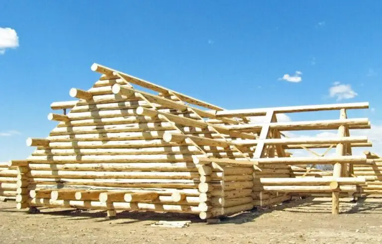 Custom log home under construction by Frontier Log Homes general contractor — photo 81