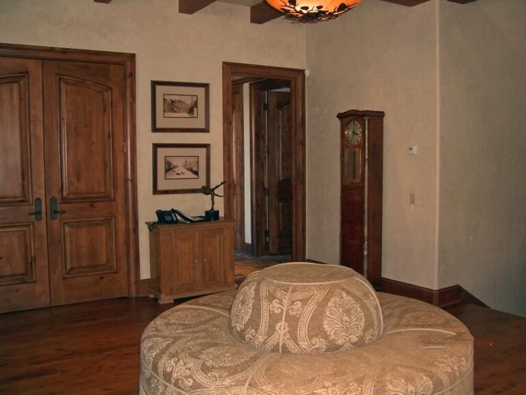 Log cabin bedroom in a custom log home — photo 22