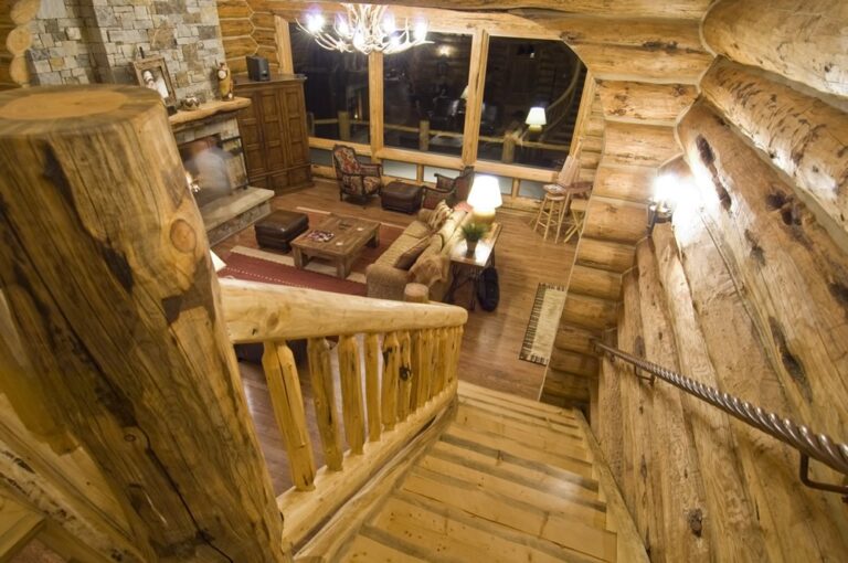 Log cabin interior of a handcrafted custom log home — photo 8