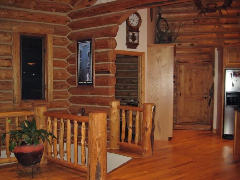 Log cabin interior of a handcrafted custom log home — photo 7