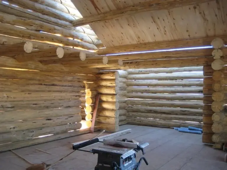 Custom log home under construction by Frontier Log Homes general contractor — photo 44