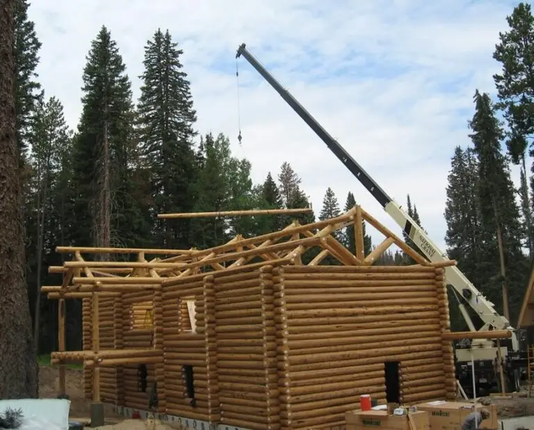 Custom log home under construction by Frontier Log Homes general contractor — photo 33