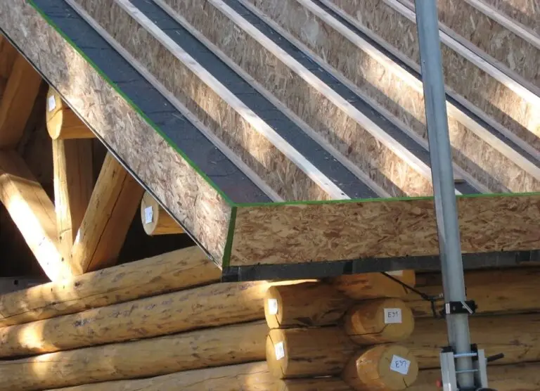 Custom log home under construction by Frontier Log Homes general contractor — photo 31
