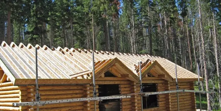 Custom log home under construction by Frontier Log Homes general contractor — photo 30